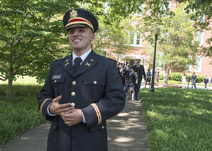 Brand new U.S. Army 2nd Lt. Allen Robertson walks across the Clemson University campus to propose to his girlfriend, Chelsea Campbell, after his Reserve Officers’ Training Corps commissioning ceremony, May 10, 2017. The two met while they were students at Clemson and will both graduate this week. Robertson, who hails from Mooresville, N.C., earned a degree in accounting at Clemson and his first duty station will be with at Fort Campbell, Ky. with the 101st Airborne Division. Campbell, of Fort Mill, S.C., earned her degree in psychology. (U.S. Army Reserve photo by Staff Sgt. Ken Scar)