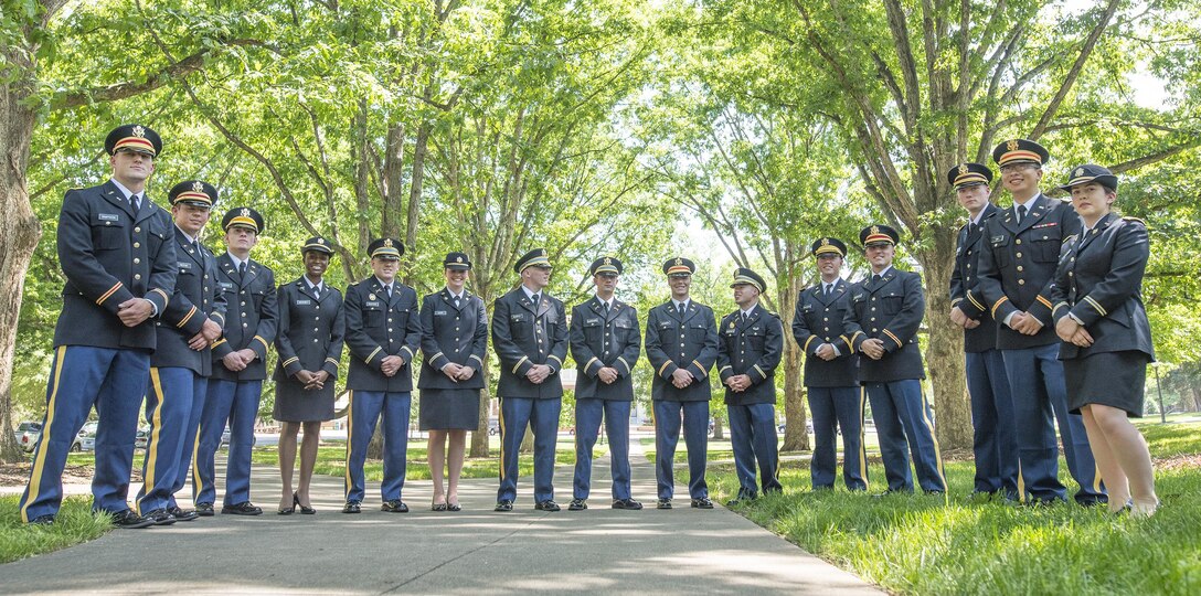 Fifteen brand new U.S. Army second lieutenants gather under the trees on the Clemson Univeristy campus after their Reserve Officers’ Training Corps commissioning ceremony, May 10, 2017. (U.S. Army Reserve photo by Staff Sgt. Ken Scar)