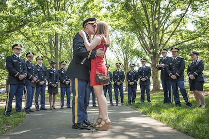 Brand new U.S. Army 2nd Lt. Allen Robertson kisses his fiance, Chelsea Campbell, after proposing to her immediately after his Clemson University Reserve Officers’ Training Corps commissioning ceremony, May 10, 2017. The two met while they were students at Clemson and will both graduate this week. Robertson, who hails from Mooresville, N.C., earned a degree in accounting at Clemson and his first duty station will be with at Fort Campbell, Ky. with the 101st Airborne Division. Campbell, of Fort Mill, S.C., earned her degree in psychology. (U.S. Army Reserve photo by Staff Sgt. Ken Scar)