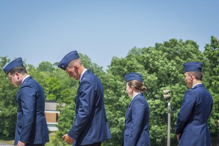 Four brand new U.S. Air Force second lieutenants prepare to receive their first salutes as officers during a Silver Dollar Ceremony on Clemson University’s Military Heritage Plaza, May 10, 2017. (U.S. Army Reserve photo by Staff Sgt. Ken Scar)