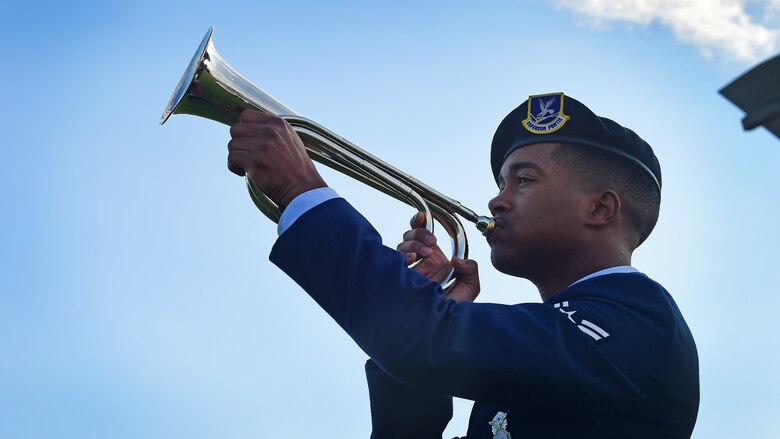 U.S. Airman 1st Class Ramon Crespo, 633rd Security Forces Squadron patrolman, plays “Taps” during the National Police Week opening ceremony at Joint Base Langley-Eustis, Va., May 15, 2017. Police Week is observed nationally to pay respects to both military and civilian law enforcement officers who have fallen in the line of duty. (U.S. Air Force photo/Staff Sgt. Areca T. Bell)