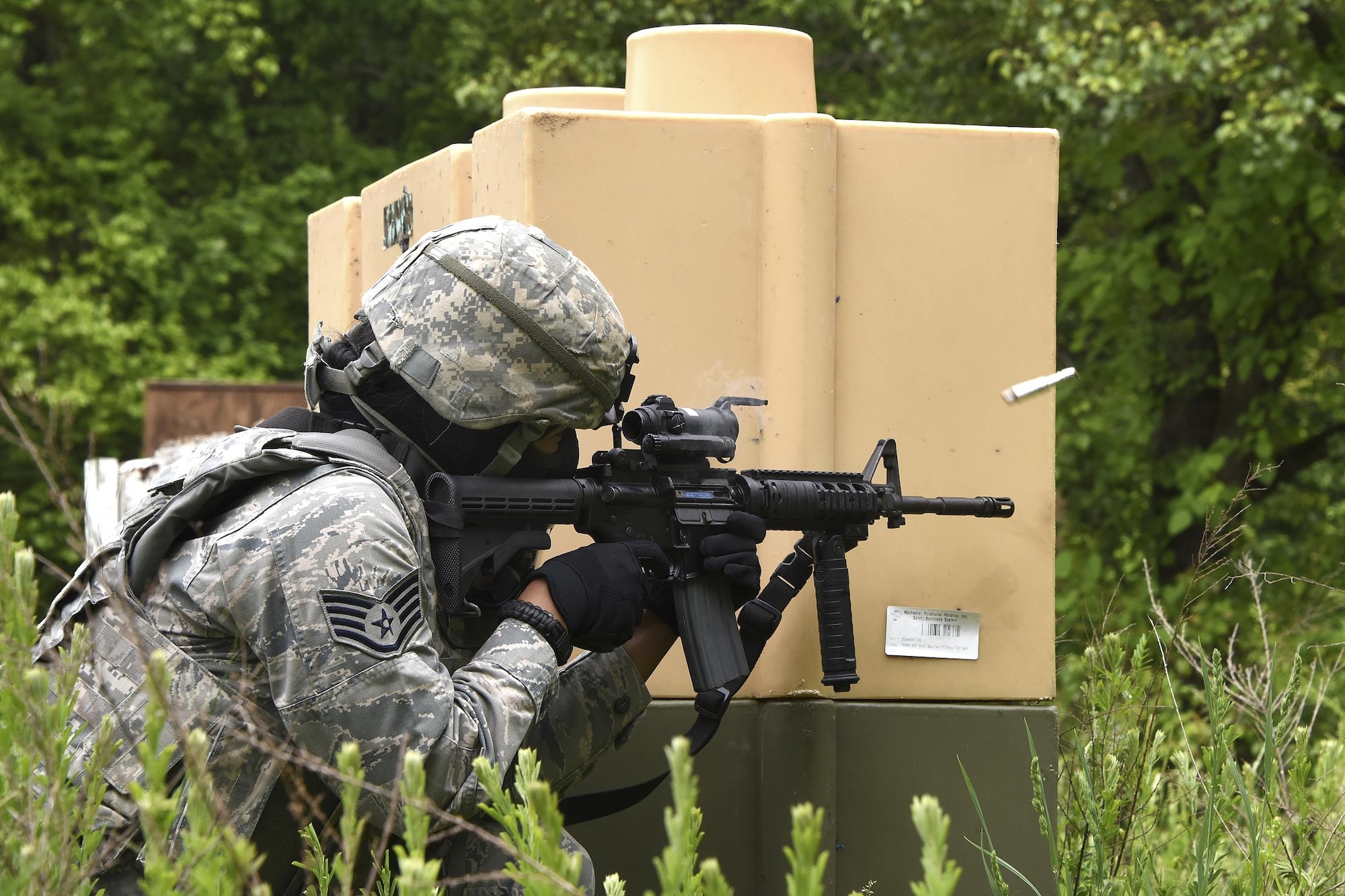 U.S. Air Force Staff Sgt. Allison Littlejohn, 459th Security Forces Squadron, engages a target with her M4 rifle during “Shoot, Move, Communicate” Training on May 7, 2017. All SFS members must qualify with the M4 Rifle and M9 pistol annually in conjunction with quarterly SMC Training in order to maintain currency and keep their skills sharp.