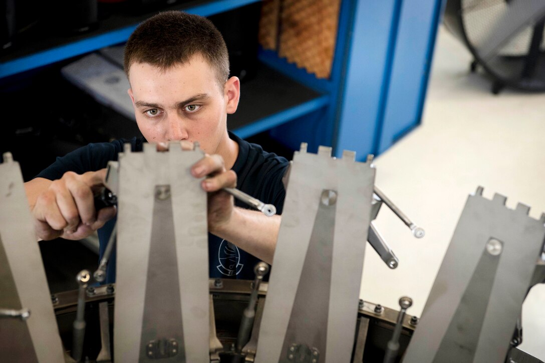 Air Force Airman 1st Class Jacob Bolanos services an F-15 Eagle engine augmenter at Kadena Air Base, Japan, May 12, 2017. Bolanos is an aerospace propulsion technician assigned to the 18th Component Maintenance Squadron. Air Force photo by Senior Airman John Linzmeier