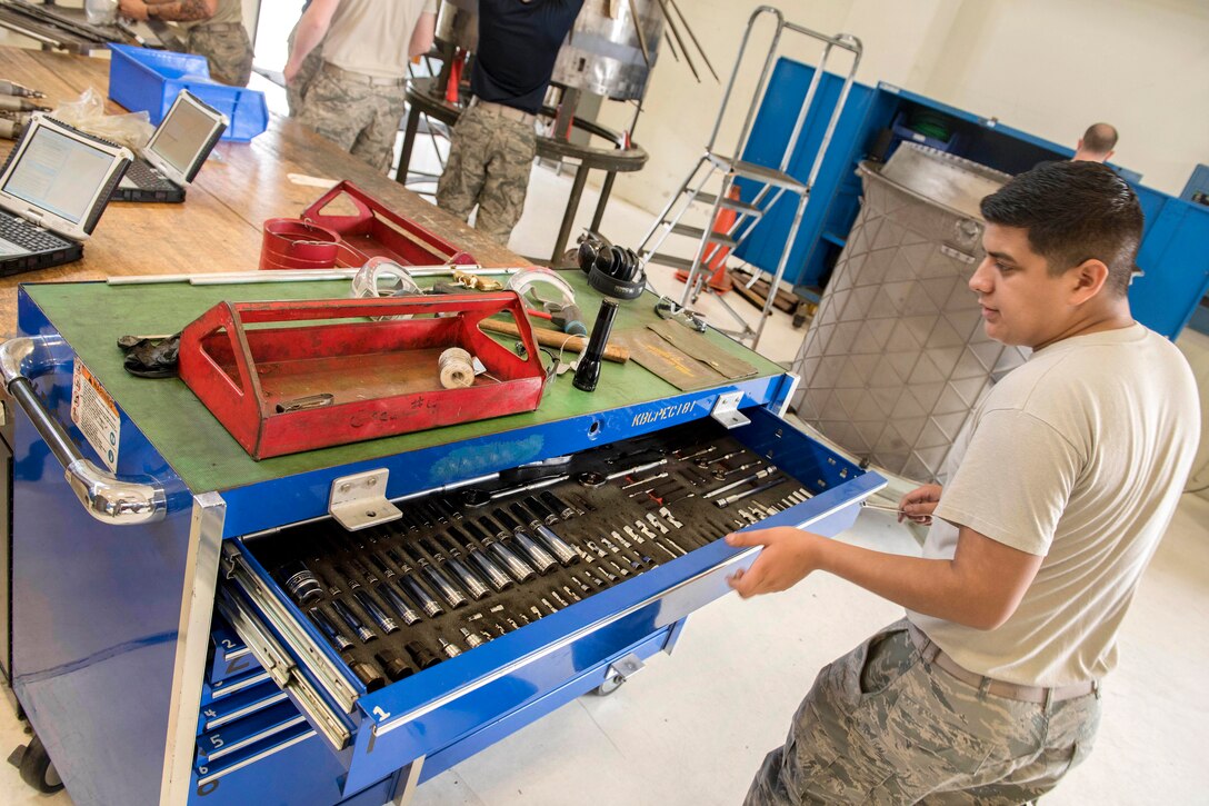 Air Force Airman 1st Class Anthony Soulek checks the toolbox before servicing an F-15 Eagle aircraft engine augmenter at Kadena Air Base, Japan, May 12, 2017. Soulek is an aerospace propulsion technician assigned to the 18th Component Maintenance Squadron. Air Force photo by Senior Airman John Linzmeier