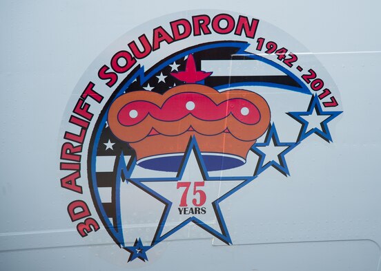 The newly unveiled commemorative logo on the nose of a C-17 Globemaster III at the 3d Airlift Squadron 75TH Anniversary Nose Art Unveiling Ceremony May 12, 2017, at Dover Air Force Base, Del. The logo will be made into a patch that squadron members can wear on Fridays. (U.S. Air Force photo by Mauricio Campino)