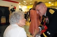 Maj. Gen. Troy. D. Kok, commanding general for the U.S. Army Reserve’s 99th Regional Support Command, greets a veteran May 12 during the 99th RSC’s dining out on Joint Base McGuire-Dix-Lakehurst, New Jersey.  The theme of the event was “Veterans: Then and Now.”  More than 100 veterans from area veteran homes were invited to attend.