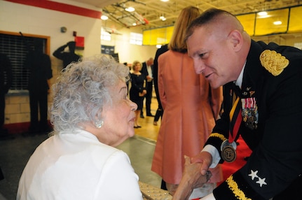 Maj. Gen. Troy. D. Kok, commanding general for the U.S. Army Reserve’s 99th Regional Support Command, greets a veteran May 12 during the 99th RSC’s dining out on Joint Base McGuire-Dix-Lakehurst, New Jersey.  The theme of the event was “Veterans: Then and Now.”  More than 100 veterans from area veteran homes were invited to attend.