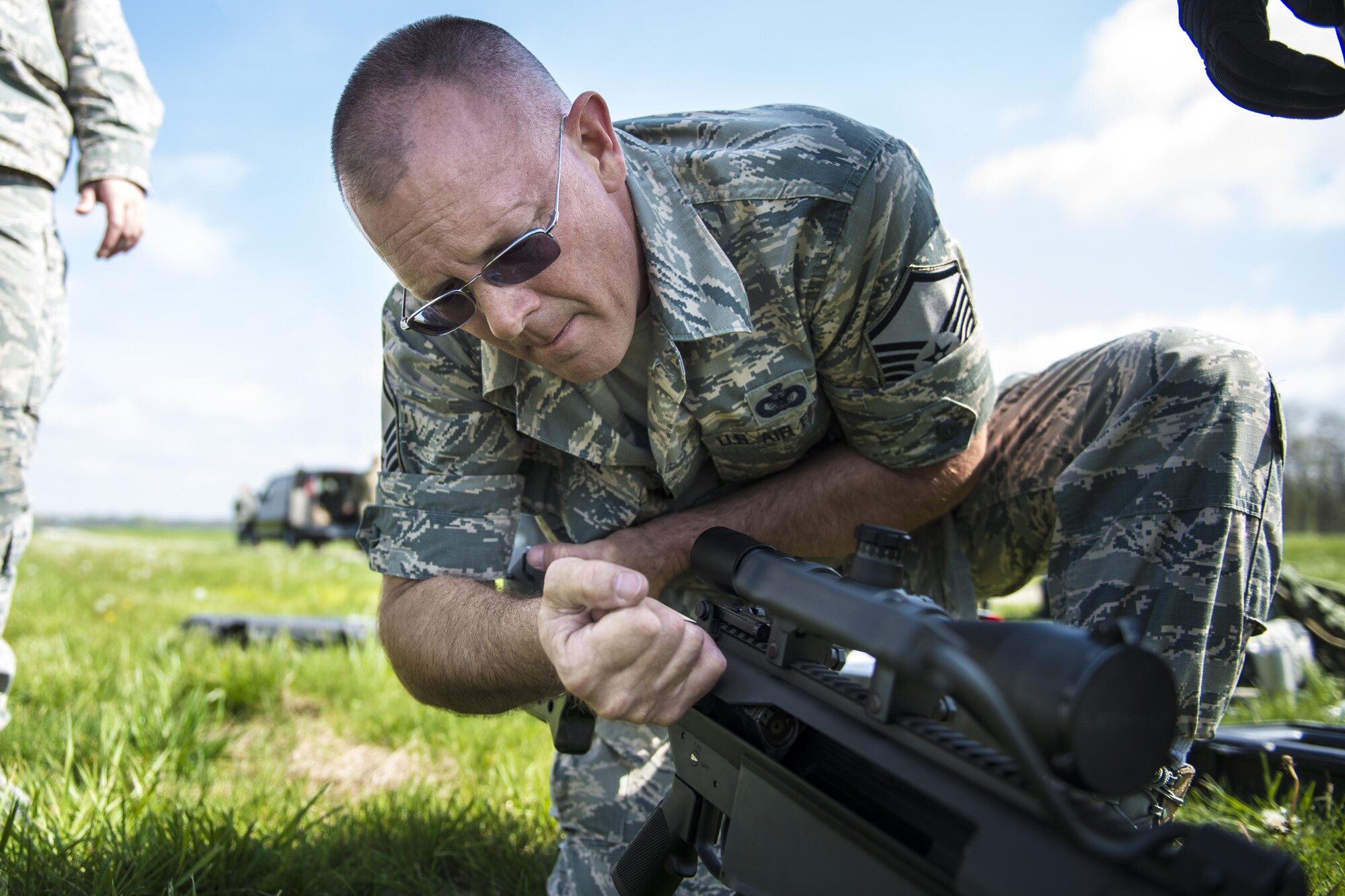 Master Sgt. Chet Nance, 434th Security Forces Squadron non-commissioned officer in charge of Combat Arms, checks the chamber of an M107A1 anti-materiel rifle before clearing it for use at Camp Atterbury-Muskatatuk, Ind., April 19, 2017. Grissom Airmen met at the Southern Indiana Army camp to complete their pre-deployment qualifications on multiple weapons systems during a week-long training operation. (U.S. Air Force Photo/Senior Airman Harrison Withrow)
