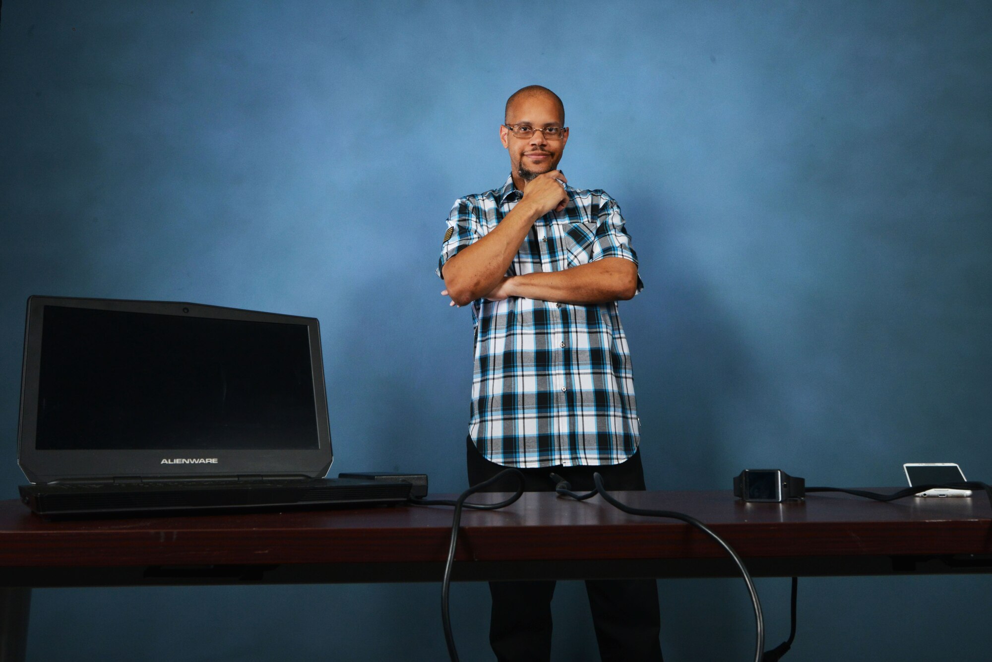 Juan Leon, 20th Force Support Squadron information technology data automation assistant, stands behind electronic devices at Shaw Air Force Base, S.C., May 16, 2017. Leon uses his class, Tech Talks with Juan, to share his love, excitement and knowledge of various kinds of technology with his fellow Team Shaw members. (U.S. Air Force photo by Airman 1st Class Destinee Sweeney)