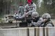 Staff Sgt. Daniel Wallace, 434th Security Forces Squadron Combat Arms instructor, supervises two 434th SFS Airmen qualifying with the M249 squad automatic weapon at Camp Atterbury-Muskatatuk, Ind., April 21, 2017. Grissom Airmen met at the Southern Indiana Army camp to complete their pre-deployment qualifications on multiple weapons systems during a week-long training operation. (U.S. Air Force Photo/Senior Airman Harrison Withrow)
