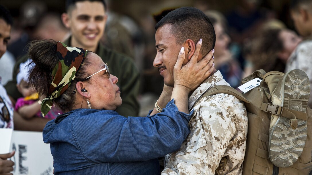 A Marine reunites with a family member at Marine Corps Air Station Cherry Point, N.C., May 15, 2017, upon returning from a deployment supporting operations in the Middle East. The Marine is assigned to Marine Attack Squadron 231. Marine Corps photo by Lance Cpl. Zachary M. Ford