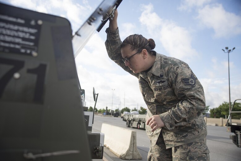 Staff Sgt Michelle Delloiacono, 436th Aerial Port Squadron special handler, visually inspects equipment during the exercise personal deployment function line May 12, 2017, on Dover Air Force Base, Del. All equipment was inspected to ensure nothing would become dislodged cause harm to the personal onboard or to the aircraft itself. (U.S. Air Force photo by Staff Sgt. Jared Duhon)
