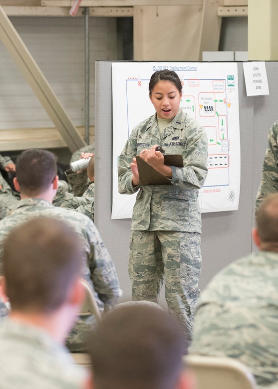 1st Lt. Dawn Resurreccion, 436th Force Support Squadron military personal section chief, states what members are to expect during the exercise personal deployment function line May 12, 2017, on Dover Air Force Base, Del. Resurreccion was the officer in charge during the PDF line, and was tasked to ensure the line was running smoothly for the deployers. (U.S. Air Force photo by Staff Sgt. Jared Duhon)