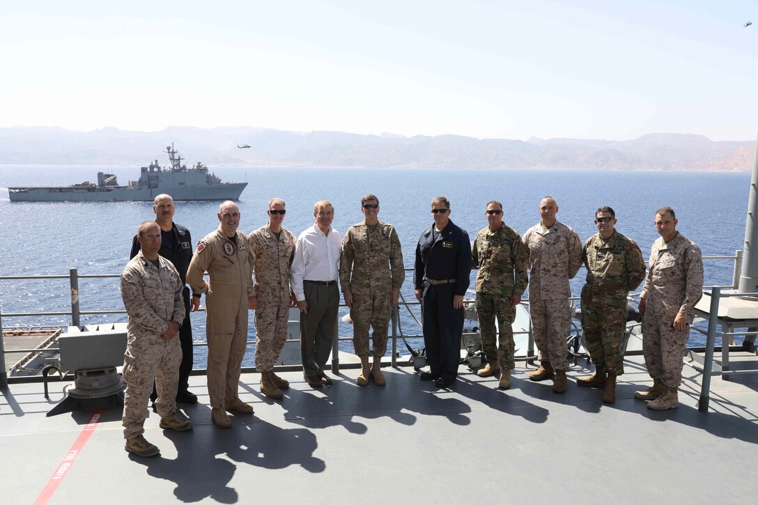 170514-N-HP188-366
U.S. 5TH FLEET AREA OF OPERATIONS (May 14, 2017) Commander, U.S. Central Command Gen. Joseph L. Votel (center) stands next to Capt. Larry LeGree, commanding officer of Amphibious Squadron (PHIBRON) 8 in a group photo on Vultures Row of the amphibious assault ship USS Bataan (LHD 5) during a ship tour during exercise Eager Lion 2017. Eager Lion is an annual U.S. Central Command exercise in Jordan designed to strengthen military-to-military relationships between the U.S., Jordan and other international partners. This year's iteration is comprised of about 7,200 military personnel from more than 20 nations that will respond to scenarios involving border security, command and control, cyber defense and battlespace management. The ship and its ready group are deployed in the U.S. 5th Fleet area of operations in support of maritime security operations designed to reassure allies and partners, and preserve the freedom of navigation and the free flow of commerce in the region.  (U.S. Navy photo by Mass Communication Specialist 3rd Class Mutis Capizzi/Released)