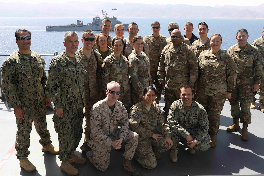 170514-N-HP188-377
U.S. 5TH FLEET AREA OF OPERATIONS (May 14, 2017)  Commander, U.S. Central Command Gen. Joseph L. Votel (last row, center) stands in a group photo on Vultures Row of the amphibious assault ship USS Bataan (LHD 5) during a ship tour during exercise Eager Lion 2017. Eager Lion is an annual U.S. Central Command exercise in Jordan designed to strengthen military-to-military relationships between the U.S., Jordan and other international partners. This year's iteration is comprised of about 7,200 military personnel from more than 20 nations that will respond to scenarios involving border security, command and control, cyber defense and battlespace management. The ship and its ready group are deployed in the U.S. 5th Fleet area of operations in support of maritime security operations designed to reassure allies and partners, and preserve the freedom of navigation and the free flow of commerce in the region.  (U.S. Navy photo by Mass Communication Specialist 3rd Class Mutis Capizzi/Released)