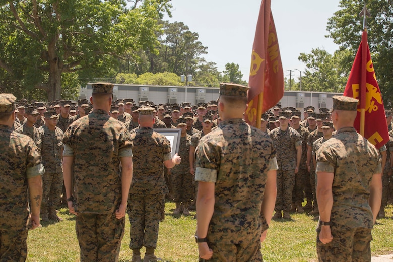 Major Gen. John K. Love, the commanding general of 2nd Marine Division, presents the Chesty Puller award during an award ceremony at Camp Lejeune, N.C., May 15, 2017. The Marines earned the award due to their impressive conduct in combat, garrison and in the field of innovation throughout the calendar year of 2016. The Marines are with 2nd Battalion, 6th Marine Regiment, 2nd Marine Division. (U.S. Marine Corps photo by Pfc. Abrey D. Liggins)