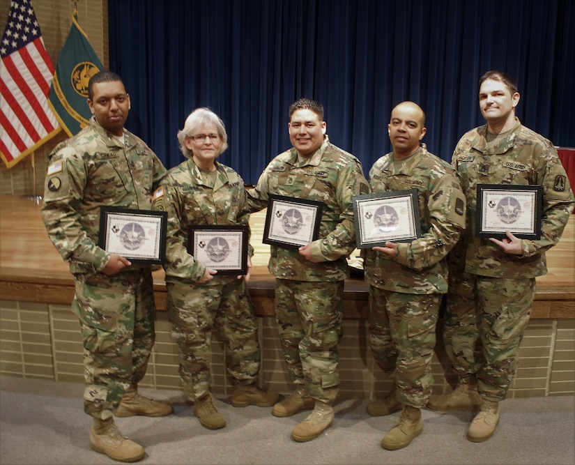 (Left to Right) U.S. Army Soldiers, Master Sgt. Ronald Cameau, Maj. Lora Hamilton, Sgt. 1st Class Carlos Laureno, Sgt. 1st Class Julian Boddy and Sgt. 1st Class Richard Royster, take a photo after a graduation ceremony for the first Cyber Center of Excellence Mobile Training Team (MTT) Cyber Common Technical Core (CCTC) course for the Army Reserve, March 10 at the Army Research Laboratory in Adelphi, Maryland. The National Capital Region Cyber Protection Center, a unit under the 335th Signal Command (Theater) Army Reserve Cyber Operations Group, lead the way with the successful organization of the MTT CCTC – an intermediate course designed to train Soldiers in military cyber network defense. (U.S. Army Reserve photo by Sgt. Erick Yates)