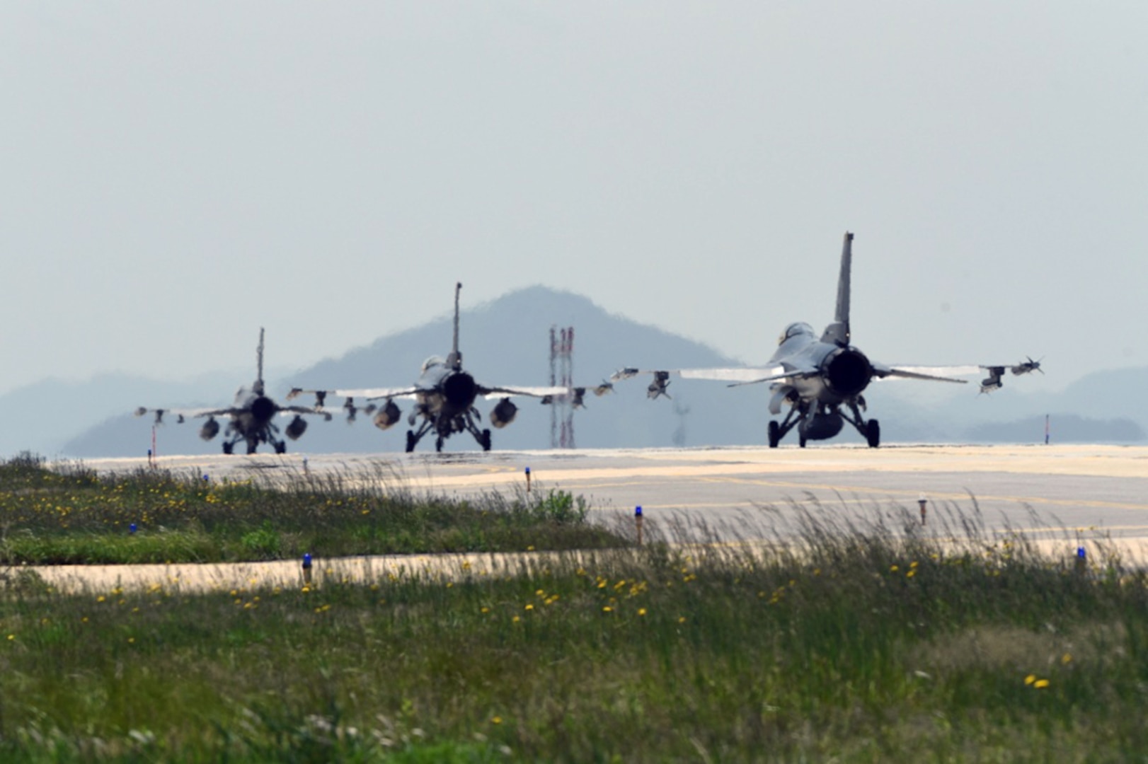 Three F-16 Fighting Falcons taxi down the flightline at Kunsan Air Base, Republic of Korea, May 15, 2017. Pilots from the 35th Fighter Squadron departed Kunsan to participate in Buddy Wing 17-4 at Jungwon Air Base, ROK. 