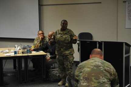 Lt. Col. Shedonta Gordon, Officer in Charge of COOP planning at U.S. Army Reserve Command, shares her personal experience of COOP operations with the ground during Continuity of Operations training held at the Major General Felix A. Santoni building on Fort Buchanan, May 11.