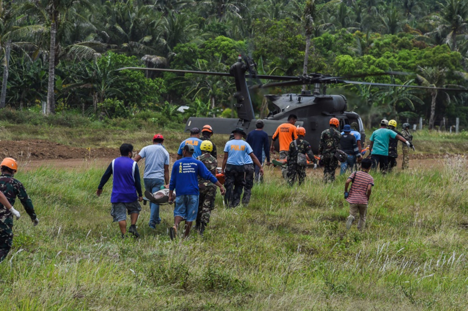 Local volunteers and members of the Calayan fire department care for wounded role players during a simulated mass casualty scenario in support of Balikatan 2017 on the island of Calayan May 16, 2017. By training together the Philippine and U.S. military build upon shared tactics, techniques, and procedures that enhance readiness and response capabilities to natural disasters. Balikatan is an annual U.S.-Philippine bilateral military exercise focused on a variety of missions, including humanitarian assistance and disaster relief, counterterrorism, and other combined military operations. 