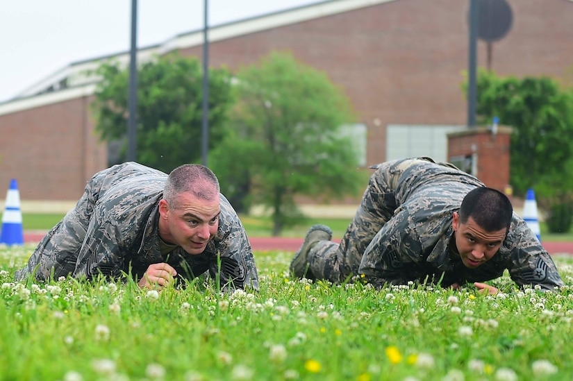 Members of the 633rd Security Forces Squadron Emergency Services Team perform a high crawl during a modified Marine Combat Physical Test at Joint Base Langley-Eustis, Va., April 28, 2017. The team provide services equal to a civilian police SWAT (Special Weapons and tactics) Team , to the installation and train to handle hostage and barricaded suspect situations. (U.S. Air Force photo/Senior Airman Derek Seifert)