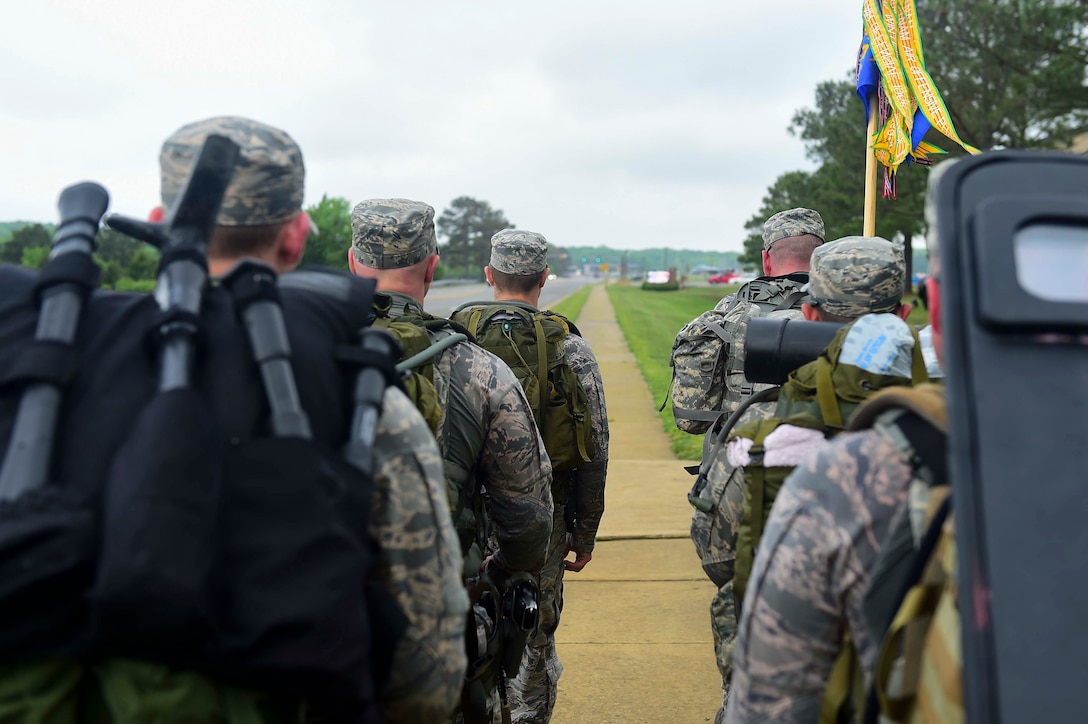 Members of the 633rd Security Forces Squadron Emergency Services Team performed a ruck march from Shellbank Fitness Center to Combat Arms Training at Joint Base Langley-Eustis, Va., April 28, 2017. The EST members developed and tested a qualification course, based on the teams abilities to effectively handle hostage and barricaded suspect scenarios, which will be used to assess future candidates looking to join the team. (U.S. Air Force photo/Senior Airman Derek Seifert)