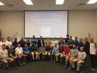 Colonel Jason Morris speaks to a group of university wrestling coaches and leaders, today, about the values Marines and wrestlers share during the NWCA leadership academy in Edwardsville, Illinois. He talked about the three missions of the U.S. Marine Corps - make Marines, win our nation’s battles and develop quality citizens - and spoke about how to adapt them so the coaches in attendance could grow wrestling. His speech focused on how training is the most important part of a leader’s job, whether it is preparing a team for battle or the wrestling mat.