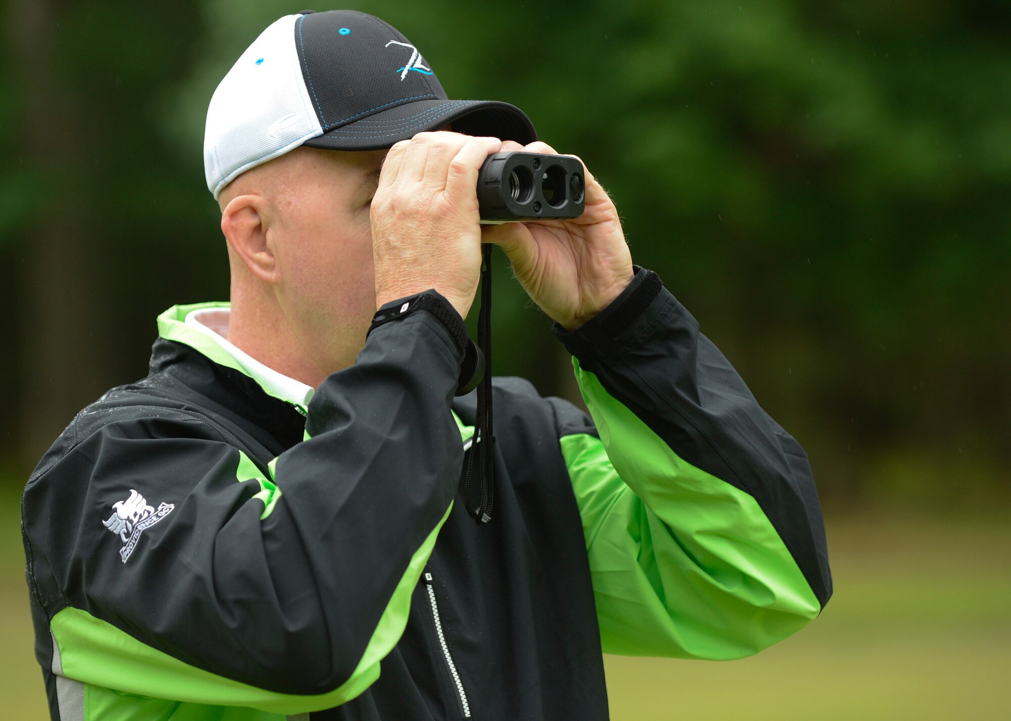 John Coullier, Headquarters Air Combat Command logistics manager, checks the distance to a hole during the Spring Commander’s Cup at Joint Base Langley-Eustis, Va., May 12, 2017. To promote a joint community, the location of the tournament rotates annually between Langley Air Force Base and Fort Eustis. (U.S. Air Force photo/Airman 1st Class Kaylee Dubois)