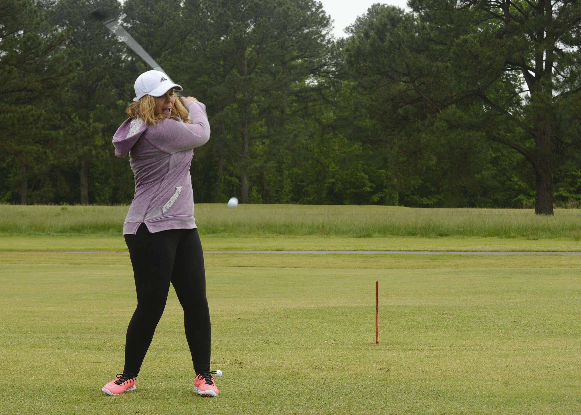 U.S. Air Force Staff Sgt. Elizabeth Heaton, 633rd Comptroller Squadron NCO in charge of special actions, hits a golf ball during the Spring Commander’s Cup at Joint Base Langley-Eustis, Va., May 12, 2017.  The tournament provided members of the JBLE community a chance to come together and enjoy a day of friendly competition. (U.S. Air Force photo/Airman 1st Class Kaylee Dubois)