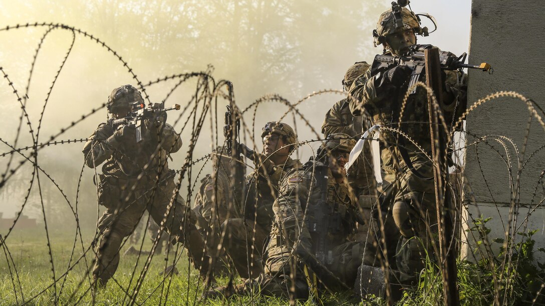 Soldiers conduct a simulated town assault during exercise Saber Junction 17 at the Hohenfels Training Area in Germany, May 15, 2017. The exercise includes nearly 4,500 participants from 13 NATO and European partner nations. Army photo by Spc. Rachel Wilridge
