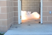 Security forces defenders from the 502nd Security Readiness Group at Joint Base San Antonio  practice tactical approach maneuvers during  May 4, 2017, at Joint Base San Antonio-Camp Bullis. Security forces Airmen and members of local police departments  participated in a 5-day Special Weapons and Tactics (SWAT) training course taught by members of the Alamo Area Council of Governments Regional Law Enforcement Academy, which aims to strengthen incident response techniques and build effective law enforcement teams. Officers certified as trainers from police departments around San Antonio area teach the course, which serves as both a refresher course for defenders and an opportunity to foster partnerships between local law enforcement members and JBSA defenders. (U.S. Force photo by Andrew C. Patterson) 