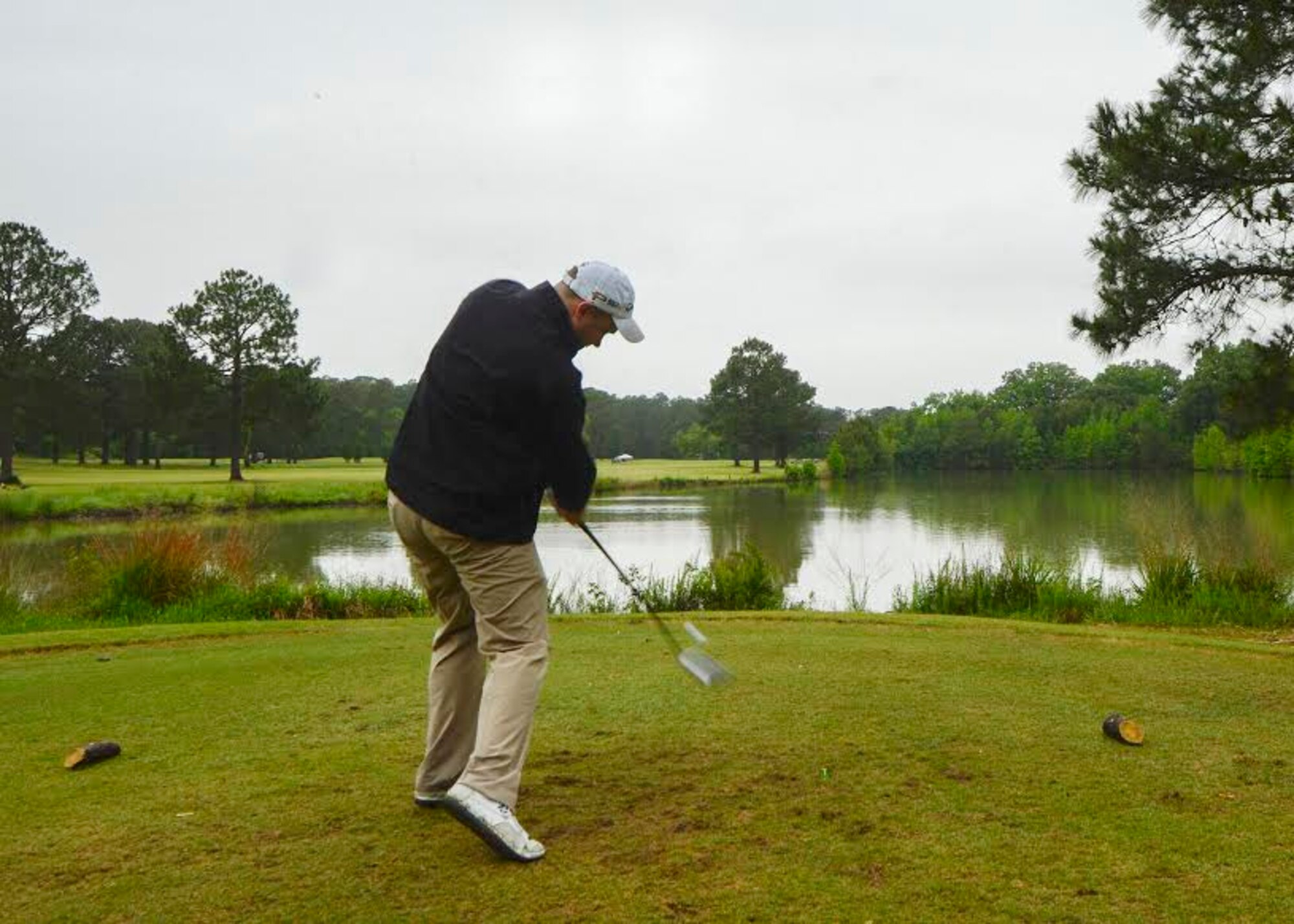 U.S. Air Force Staff Sgt. Rob Vineyard, 633rd Comptroller Squadron NCO in charge of military pay, hits a golf ball during the Spring Commander’s Cup at Joint Base Langley-Eustis, Va., May 12, 2017. With teams of four, tournament participants played until par, ensuring the game moved at a steady pace. (U.S. Air Force photo/Airman 1st Class Kaylee Dubois)