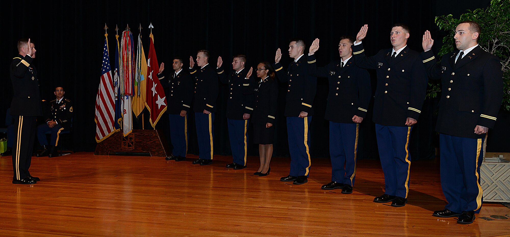 U.S. Army Gen. David Perkins, commanding general of U.S. Army Training and Doctrine Command, administers the Oath of Office to eight ROTC cadets during a Commissioning Ceremony at the College of William & Mary in Williamsburg, Va., May 12, 2017. The Oath of Office is required by U.S. Code prior to commissioning. (U.S. Air Force photo/Staff Sgt. Teresa J. Cleveland)