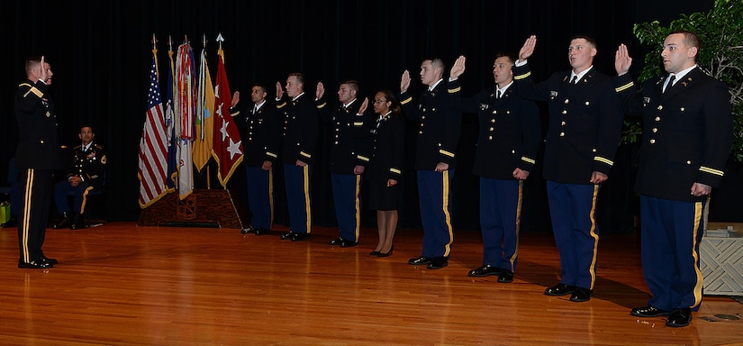 U.S. Army Gen. David Perkins, commanding general of U.S. Army Training and Doctrine Command, administers the Oath of Office to eight ROTC cadets during a Commissioning Ceremony at the College of William & Mary in Williamsburg, Va., May 12, 2017. The Oath of Office is required by U.S. Code prior to commissioning. (U.S. Air Force photo/Staff Sgt. Teresa J. Cleveland)