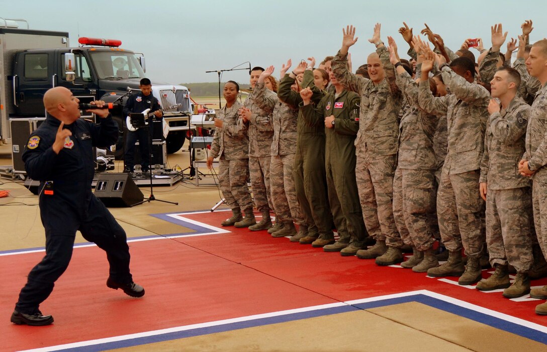 Master Sergeant "Quez' Vasquez, vocalist for Full Spectrum, performs for Airmen during the Good Morning America broadcast from Langley Air Force Base, Virginia.