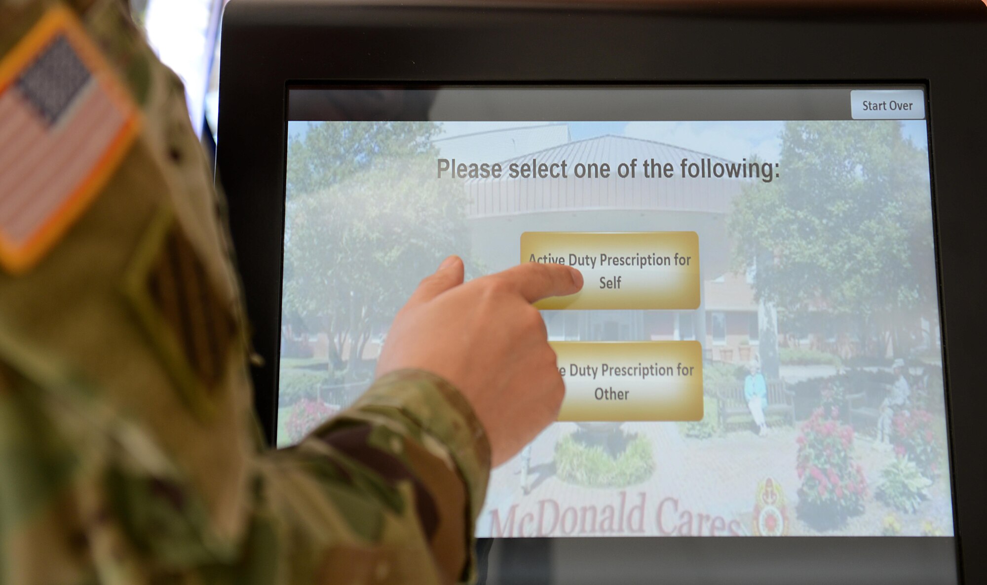 An U.S. Army Soldier selects the appropriate option on the queuing system in the McDonald Army Health Center Pharmacy at Joint Base Langley-Eustis, Va., May 9, 2017. The MCAHC pharmacy personnel provide care to approximately 98 percent of beneficiaries within 30 minutes. (U.S. Air Force photo/Staff Sgt. Teresa J. Cleveland)