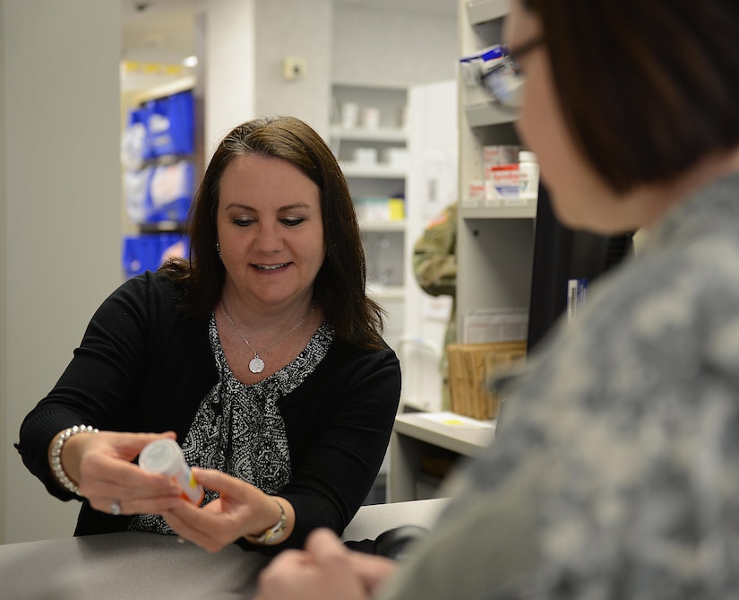 Dr. Jessica Pruitt, McDonald Army Health Center lead pharmacist, discusses a prescription with a patient at Joint Base Langley-Eustis, Va., May 9, 2017. Pharmacists and technicians are responsible for ensuring prescriptions are given to the right patient with the correct dosage, frequency and instructions on the label. (U.S. Air Force photo/Staff Sgt. Teresa J. Cleveland)