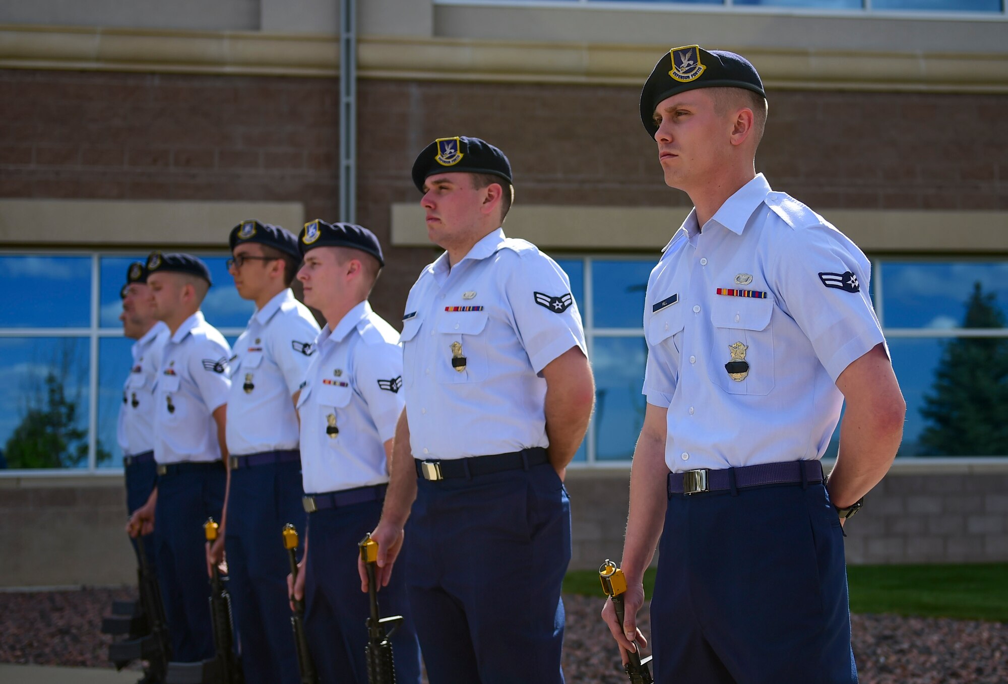 Members of the 460th Security Forces Squadron prepare to fire their weapons for the 21-gun salute in honor of fallen civilian and military law enforcement officers during a Retreat ceremony May 15, 2017, on Buckley Air Force Base, Colo. The 21-gun salute is a three-round volley carried out by seven riflemen in honor of the dead. (U.S. Air Force photo by Airman Jacob Deatherage/Released)