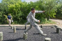 Members of the 802nd and 902 Security Forces Squadrons compete in the Obstacle Course Team Challenge May 15, 2017, at Joint Base San Antonio-Lackland, Texas Medina Annex. The event was held as part of National Police Week, an annual celebration to honor the service and sacrifice of law enforcement members and pays special tribute to law enforcement officers who have lost their lives in the line of duty for the safety and protection of others. JBSA security forces members participated participate in events weeklong May 15-19 across the installations. (U.S. Air Force photo by Staff Sgt. Marissa Garner)