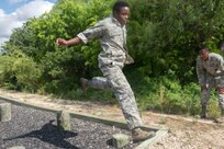 Members of the 802nd and 902 Security Forces Squadrons compete in the Obstacle Course Team Challenge May 15, 2017, at Joint Base San Antonio-Lackland, Texas Medina Annex. The event was held as part of National Police Week, an annual celebration to honor the service and sacrifice of law enforcement members and pays special tribute to law enforcement officers who have lost their lives in the line of duty for the safety and protection of others. JBSA security forces members participated participate in events weeklong May 15-19 across the installations. (U.S. Air Force photo by Staff Sgt. Marissa Garner)