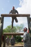 Members of the 802nd and 902 Security Forces Squadrons compete in the Obstacle Course Team Challenge May 15, 2017, at Joint Base San Antonio-Lackland, Texas Medina Annex. The event was held as part of National Police Week, an annual celebration to honor the service and sacrifice of law enforcement members and pays special tribute to law enforcement officers who have lost their lives in the line of duty for the safety and protection of others. JBSA security forces members participated participate in events weeklong May 15-19 across the installations. (U.S. Air Force photo by Staff Sgt. Marissa Garner)