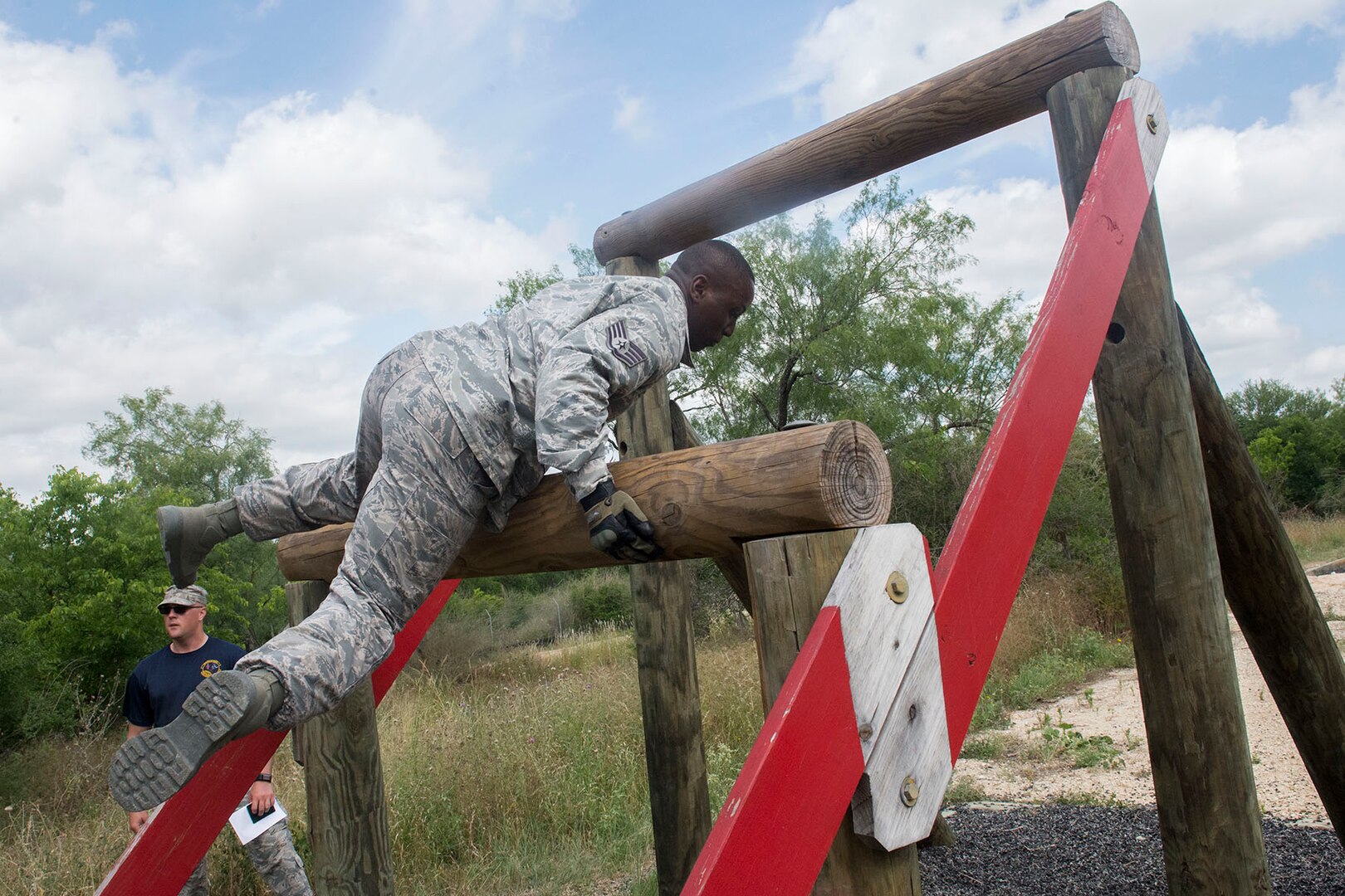 Members of the 802nd and 902 Security Forces Squadrons compete in the Obstacle Course Team Challenge May 15, 2017, at Joint Base San Antonio-Lackland, Texas Medina Annex. The event was held as part of National Police Week, an annual celebration to honor the service and sacrifice of law enforcement members and pays special tribute to law enforcement officers who have lost their lives in the line of duty for the safety and protection of others. JBSA security forces members participated participate in events weeklong May 15-19 across the installations. (U.S. Air Force photo by Staff Sgt. Marissa Garner)