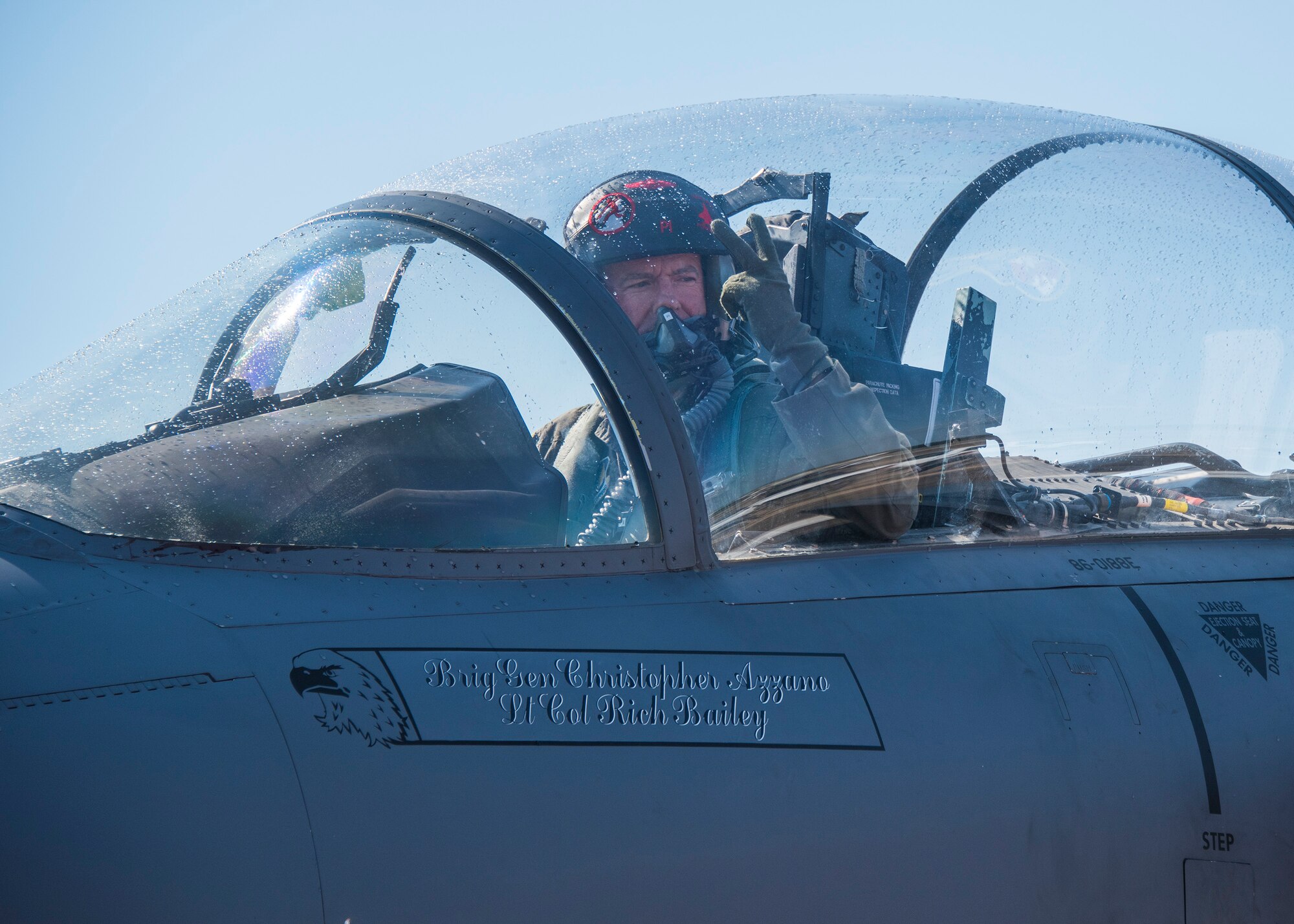 Brig. Gen. Christopher Azzano, 96thTest Wing commander, signals aircraft maintainers during his fini flight at Eglin Air Force Base, Fla. May 15. The fini flight is a symbol of a member’s final flight with the unit or base. Azzano’s new assignment will take him to Wright-Patterson Air Force Base in Ohio to take command of the Directorate of Air, Space and Cyberspace Operations. (U.S. Air Force photo/Ilka Cole)