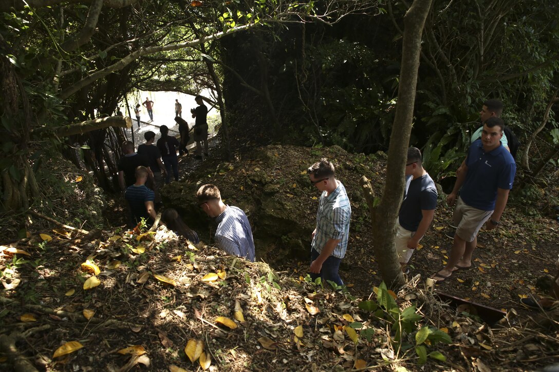 Marines with the 31st Marine Expeditionary Unit hike down a hill at Hacksaw Ridge, Okinawa, Japan, May 4, 2017. The Marines, non-commissioned officers with the MEU, visited World War II battle sites throughout Okinawa as part of a Marine Corps Community Services tour that was intended to boost morale throughout the NCO corps of the 31st MEU and sharpen the Marines’ mental readiness. As the Marine Corps’ only continuously forward deployed unit, the 31st Marine Expeditionary Unit’s air-ground-logistics team provides a flexible force, ready to perform a wide range of military operations, from limited combat to humanitarian assistance operations, throughout the Asia-Pacific region. (U.S. Marine Corps photo by Sgt. Tiffany Edwards)
