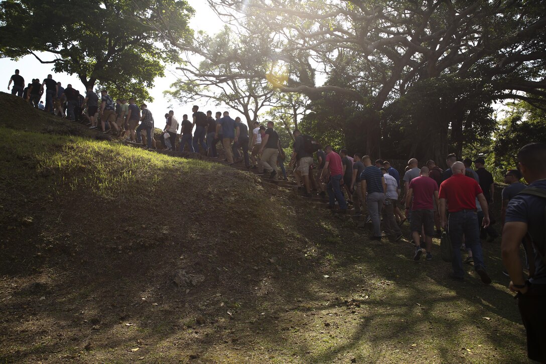 Marines with the 31st Marine Expeditionary Unit hike up a hill at Hacksaw Ridge, Okinawa, Japan, May 4, 2017. The Marines, non-commissioned officers with the MEU, visited World War II battle sites throughout Okinawa as part of a Marine Corps Community Services tour that was intended to boost morale throughout the NCO corps of the 31st MEU and sharpen the Marines’ mental readiness. As the Marine Corps’ only continuously forward deployed unit, the 31st Marine Expeditionary Unit’s air-ground-logistics team provides a flexible force, ready to perform a wide range of military operations, from limited combat to humanitarian assistance operations, throughout the Asia-Pacific region. (U.S. Marine Corps photo by Sgt. Tiffany Edwards)