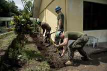 Philippine and U.S. service members dig a drainage ditch during Balikatan in Ormoc City, Leyte, May 12, 2017. Philippine and U.S. service members worked together to build new classrooms for students at Don Carlos Elementary School. Balikatan is an annual U.S.-Philippine bilateral military exercise focused on a variety of missions, including humanitarian assistance and disaster relief, counterterrorism, and other combined military operations. (U.S. Air Force photo by Staff Sgt. Peter Reft)