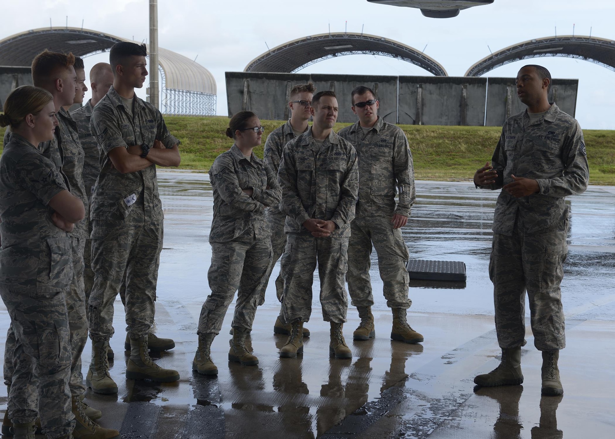 Airmen from the First Term Airmen Center listen to a B-1Lancer crew chief explain the different parts of the aircraft during the Pacific Airpower Tour May 15, 2017, at Andersen Air Force Base, Guam. The tour is held to introduce new Airmen to the various career fields that play a role in supporting the mission. (U.S. Air Force photo by Senior Airman Cierra Presentado/Released)