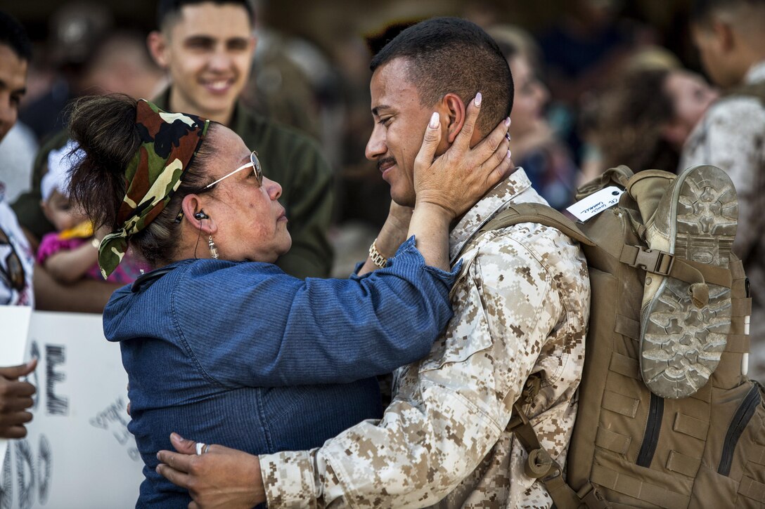 A Marine reunites with a family member at Marine Corps Air Station Cherry Point, N.C., May 15, 2017, upon returning from a deployment supporting operations in the Middle East. The Marine is assigned to Marine Attack Squadron 231. Marine Corps photo by Lance Cpl. Zachary M. Ford