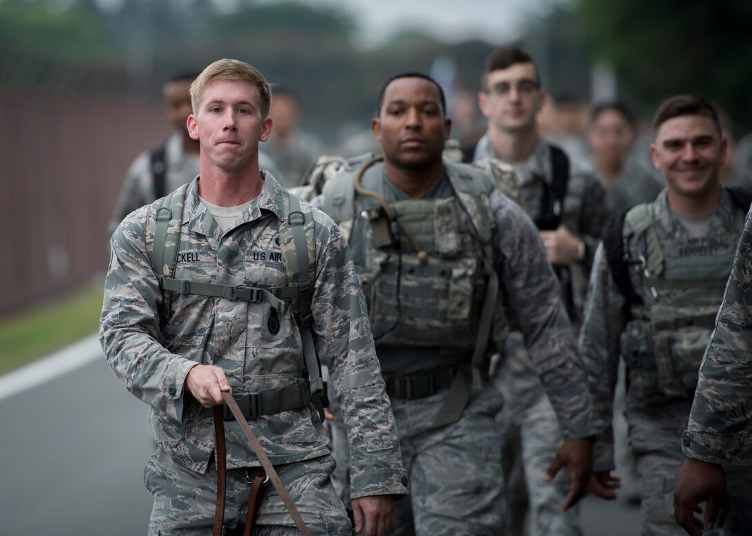 Participants in the Memorial 5K Ruck March lead the group, May 15, 2017, at Yokota Air Base, Japan. The Memorial 5K Ruck March was in remembrance of all the Security Forces and law enforcement members that were killed in the line of duty. (U.S. Air Force photo by Airman 1st Class Donald Hudson)
