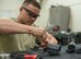 U.S. Air Force Senior Airman Joshua Wood, a 35th Maintenance Squadron armament technician, works on a clearing solenoid at Kunsan Air Base, Republic of Korea, May 15, 2017. Wood had to completely replace the clearing solenoid because it was damaged beyond repair. This piece of equipment places the round in the clearing cam path of a M61A1 20mm Gatling Gun. Every 18 months they completely break down the M61A1 and rebuild it, repairing or replacing any components. (U.S. Air Force photo by Senior Airman Brittany A. Chase)